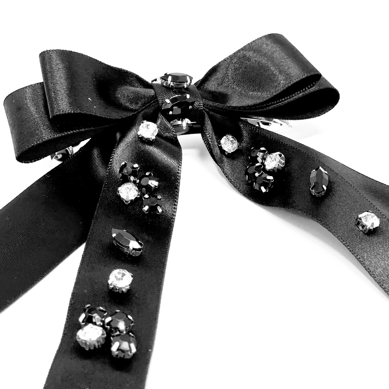 Black hair clip with a bow designed with crystals