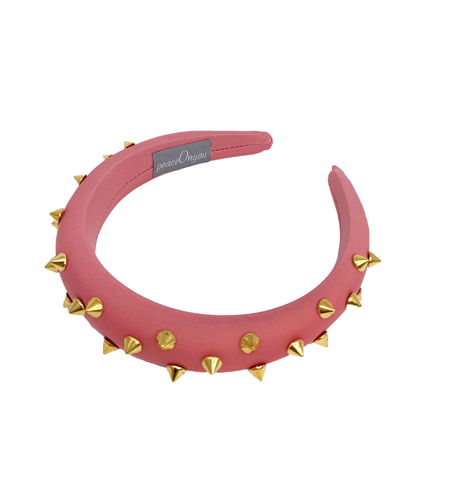 Pink padded headband with gold spikes